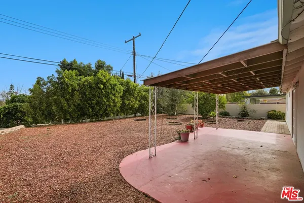 a view of a yard with an outdoor space