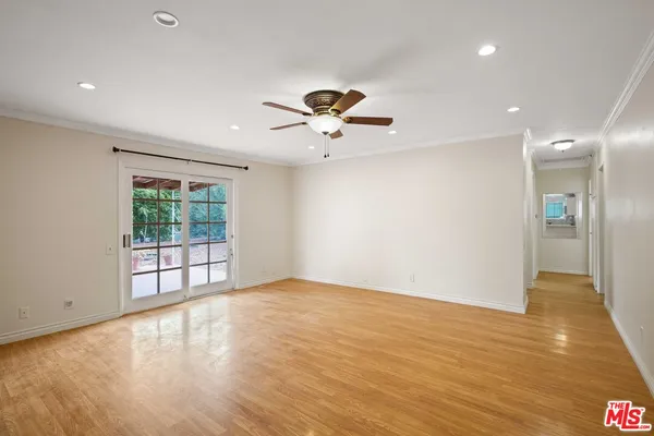 a view of an empty room with a window