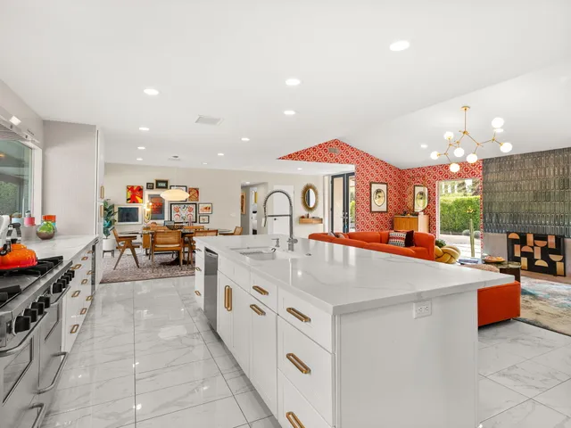 a view of kitchen island with stainless steel appliances lots of counter top space