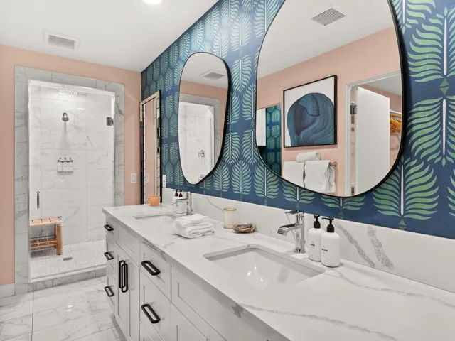 a bathroom with a sink mirror and vanity