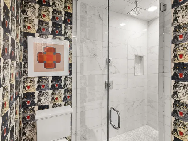 a bathroom with a shower and a sink