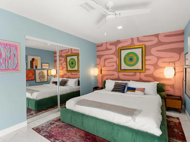 a bedroom with a bed and dresser