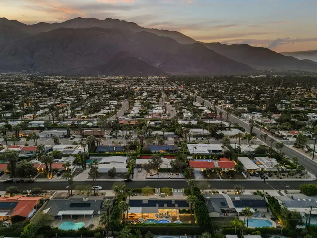 an aerial view of residential houses and outdoor space
