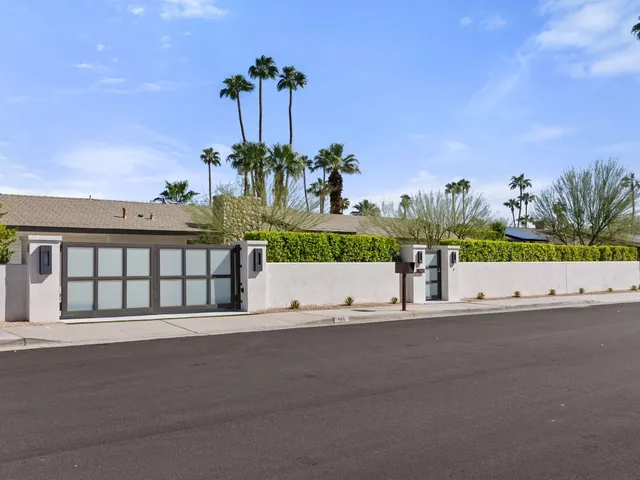 a view of a house with a yard and garage