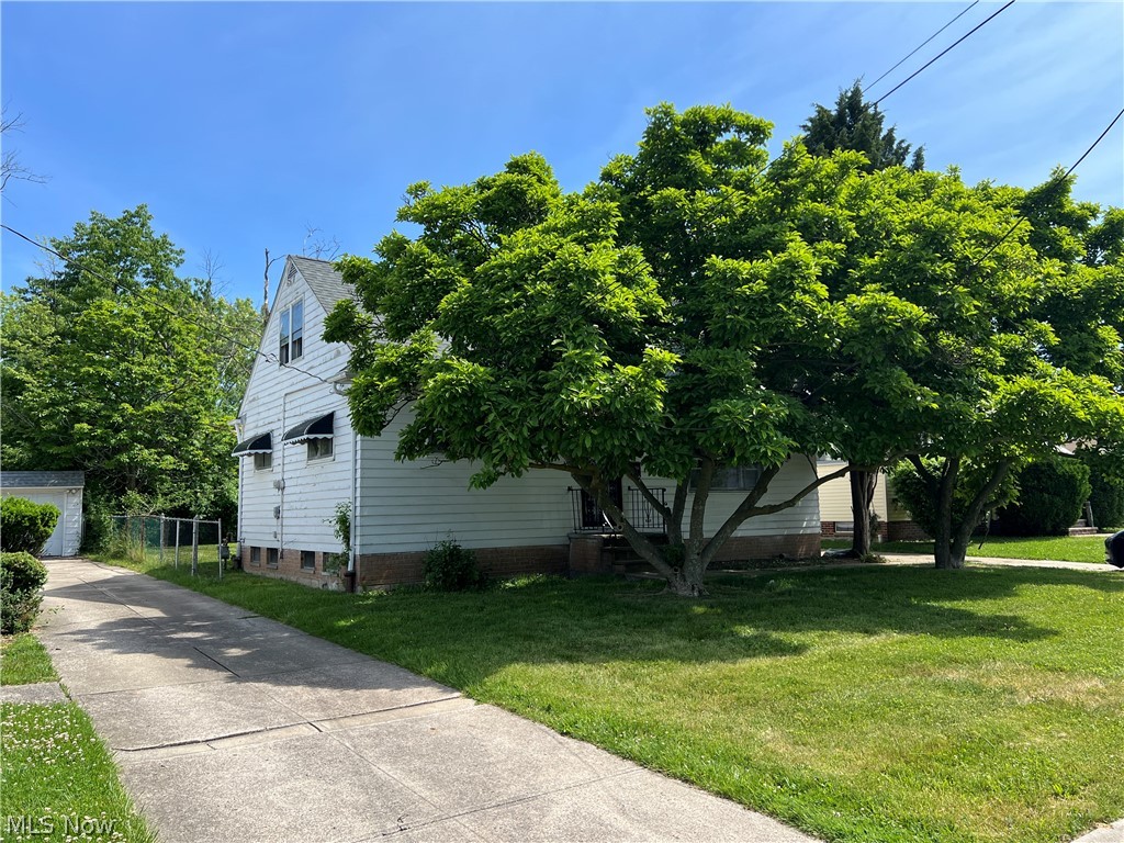 20731 Donnybrook Road Maple Heights, OH 44137 - Photo 15 of 17 View of side of property with a yard