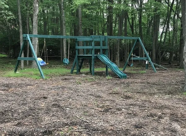 a view of a backyard with a slide