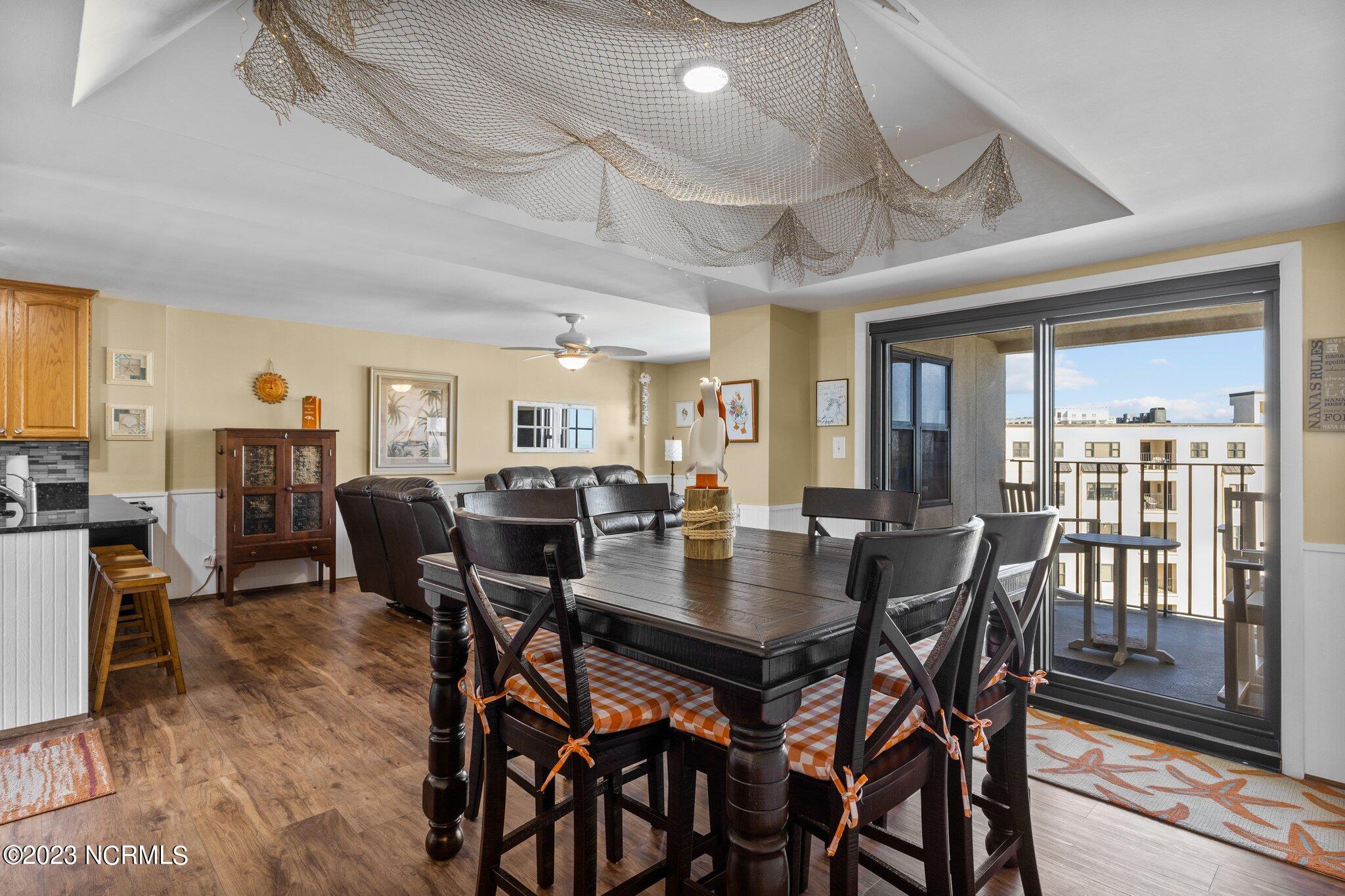 1505 Salter Path Road, Unit 508A Indian Beach, NC 28512 - Photo 10 of 50 Dining Area & Balcony Access