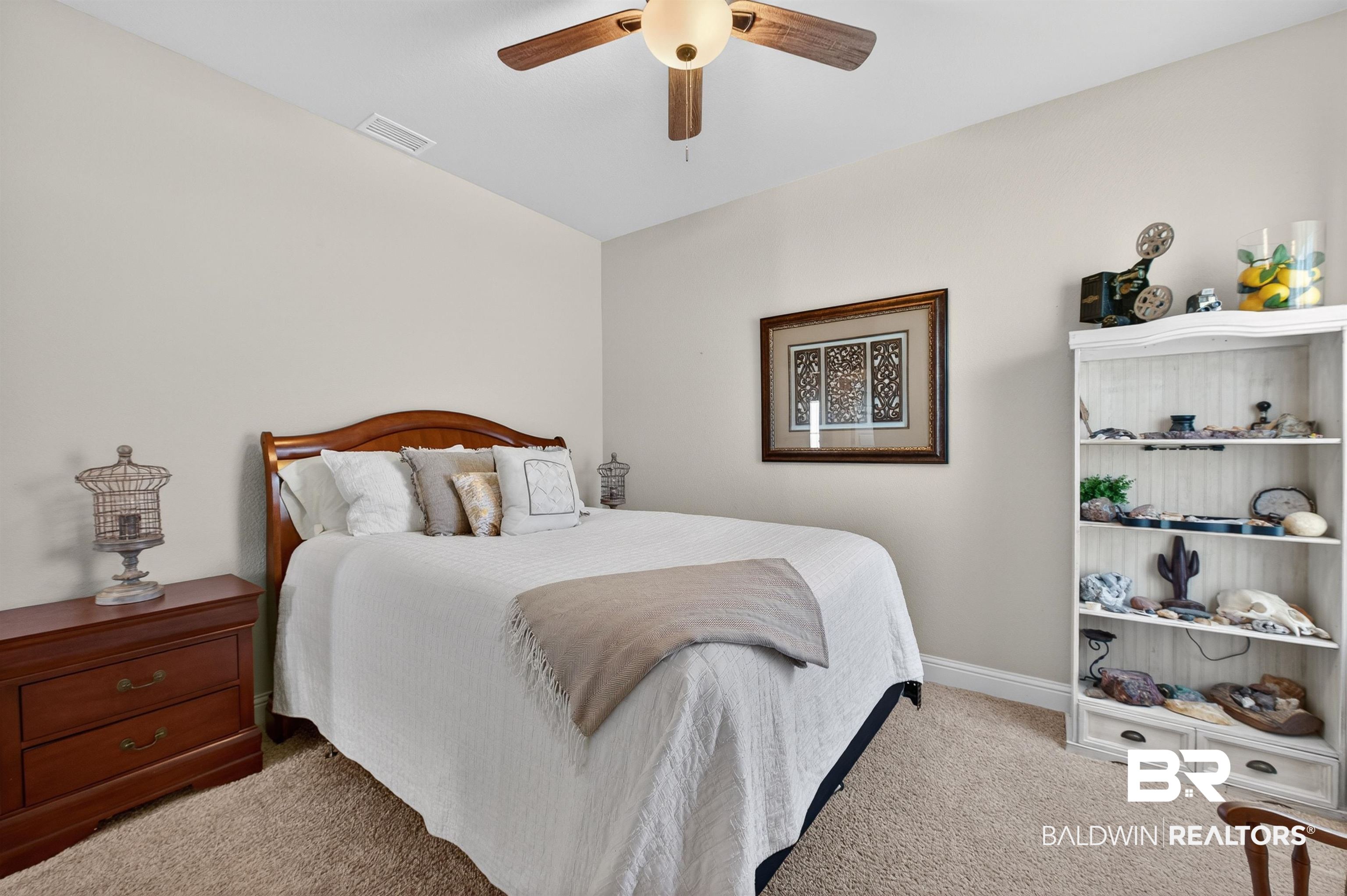 8735 Bronze Lane Foley, AL 36535 - Photo 29 of 58 Neutral wall tones and plush carpeting create a serene ambiance