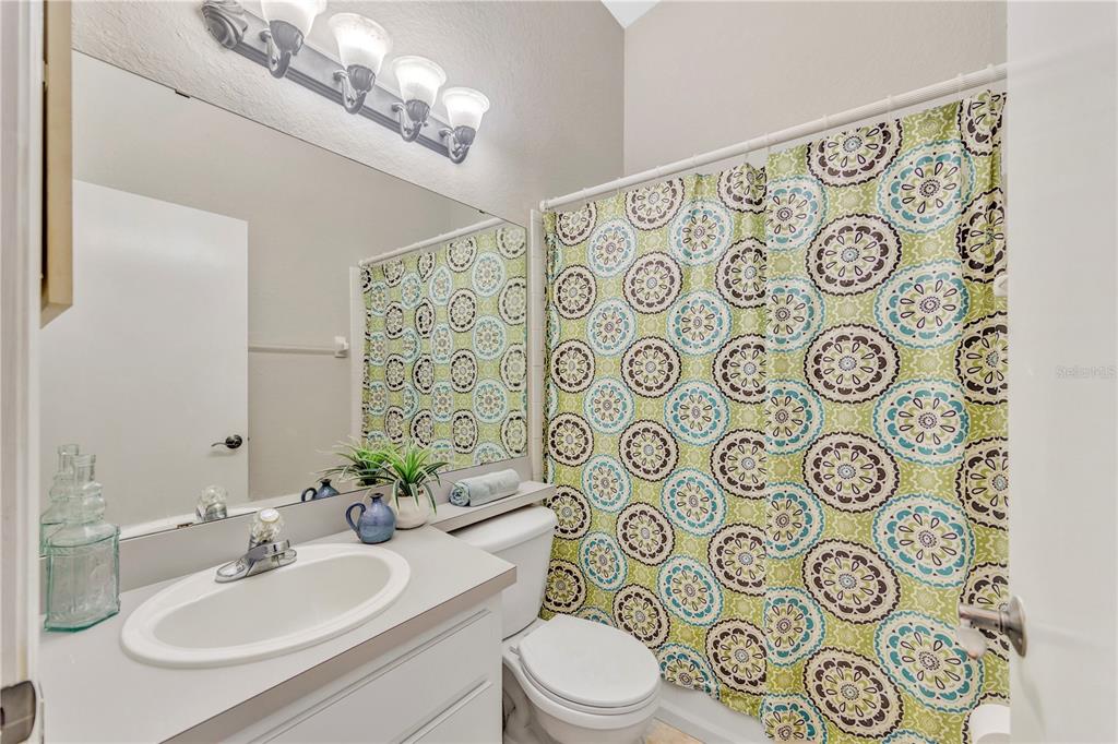 601 Parsons Reserve Court Seffner, FL 33584 - Photo 17 of 21 a bathroom with a toilet sink shower and mirror