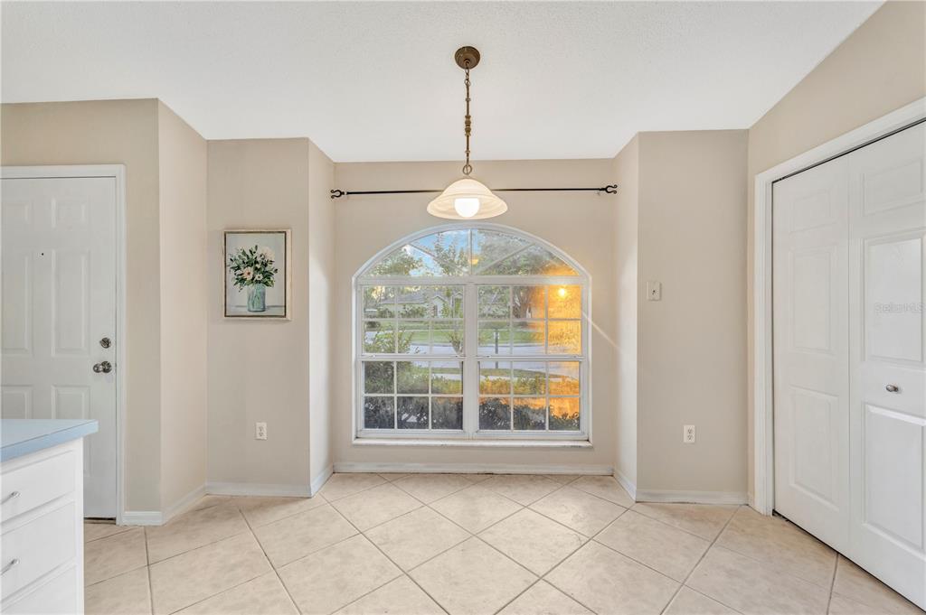 601 Parsons Reserve Court Seffner, FL 33584 - Photo 8 of 21 a view of an empty room with window and chandelier fan