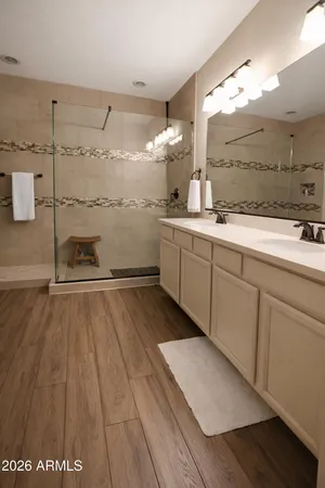 a bathroom with a sink and a mirror