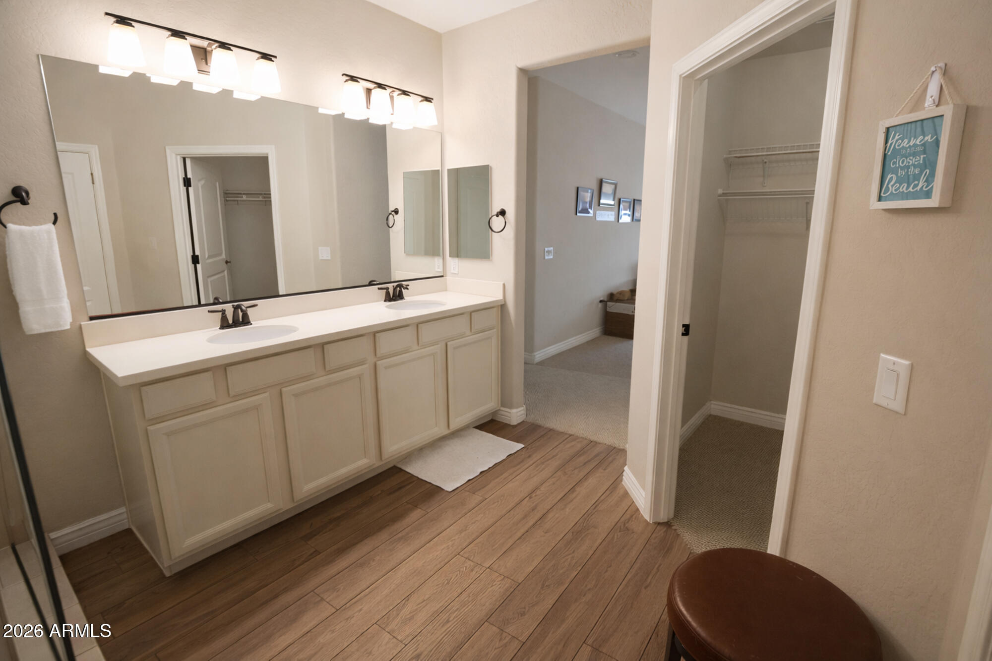 2425 West Bronco Butte Trail, Unit 2007 Phoenix, AZ 85085 - Photo 16 of 30 a bathroom with a double vanity sink toilet and shower