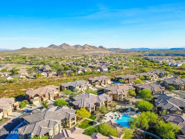 a view of a city with mountains in the background