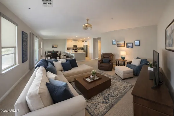 a living room with furniture rug and window