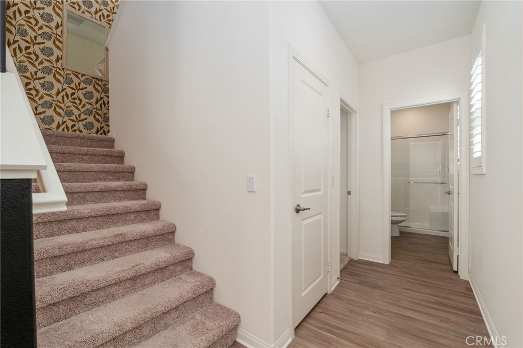 13430 Limestone Drive Yucaipa, CA 92399 - Photo 14 of 30 a view of a hallway with wooden floor and entryway