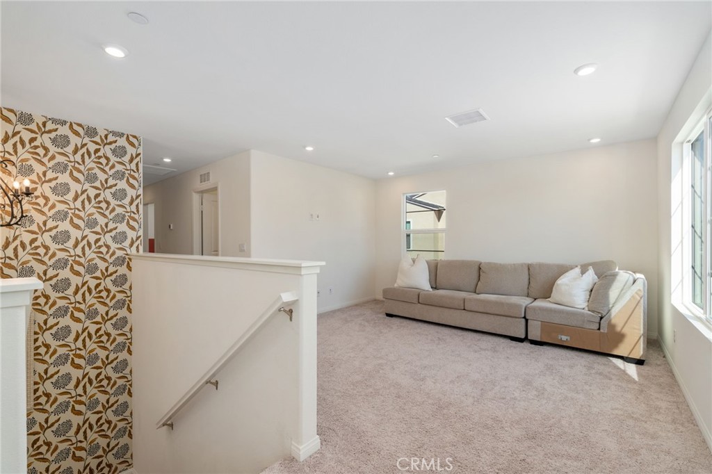 13430 Limestone Drive Yucaipa, CA 92399 - Photo 15 of 30 a living room with furniture and a couch