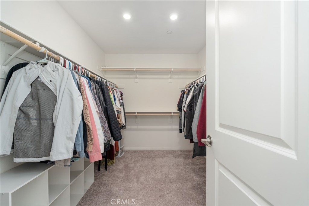 13430 Limestone Drive Yucaipa, CA 92399 - Photo 20 of 30 a view of walk in closet with clothes