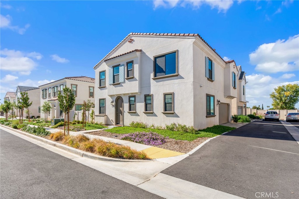 13430 Limestone Drive Yucaipa, CA 92399 - Photo 2 of 30 a front view of a house with a garden