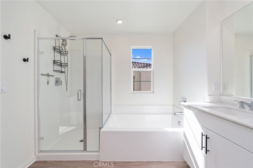 13430 Limestone Drive Yucaipa, CA 92399 - Photo 22 of 30 a bathroom with a shower and a bathtub