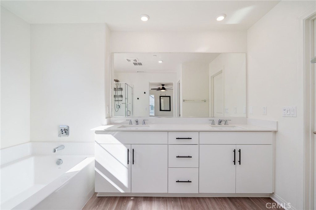 13430 Limestone Drive Yucaipa, CA 92399 - Photo 23 of 30 a bathroom with a sink double vanity granite tub and shower