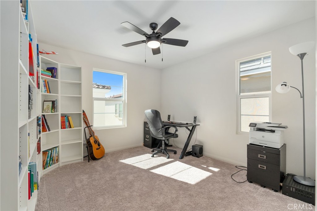 13430 Limestone Drive Yucaipa, CA 92399 - Photo 28 of 30 a view of a workspace with furniture and a window