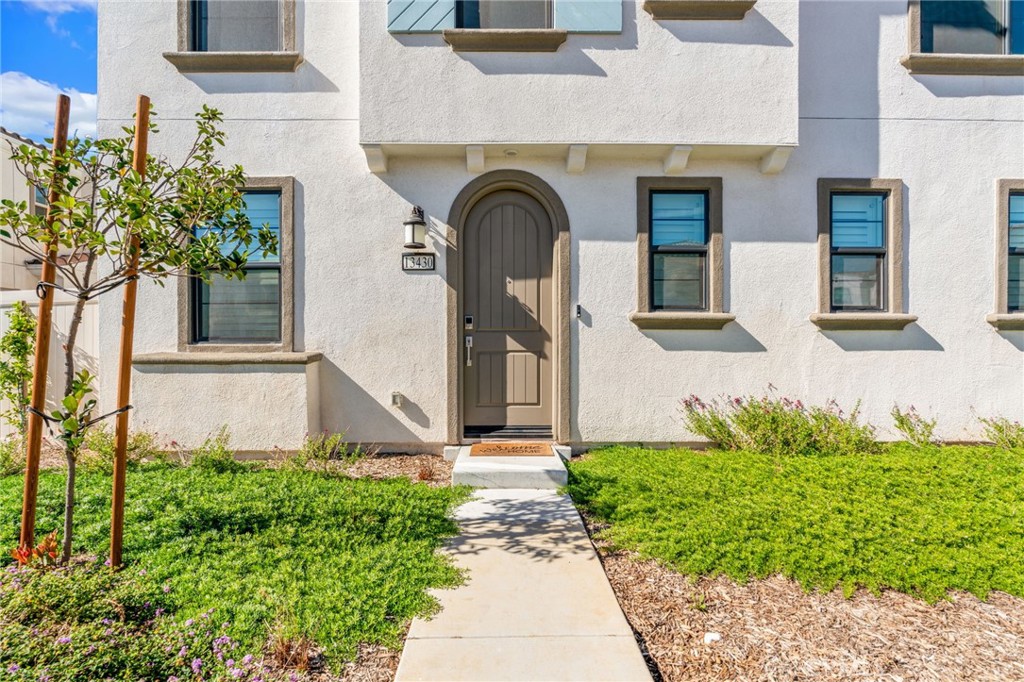 13430 Limestone Drive Yucaipa, CA 92399 - Photo 3 of 30 a front view of a house with garden