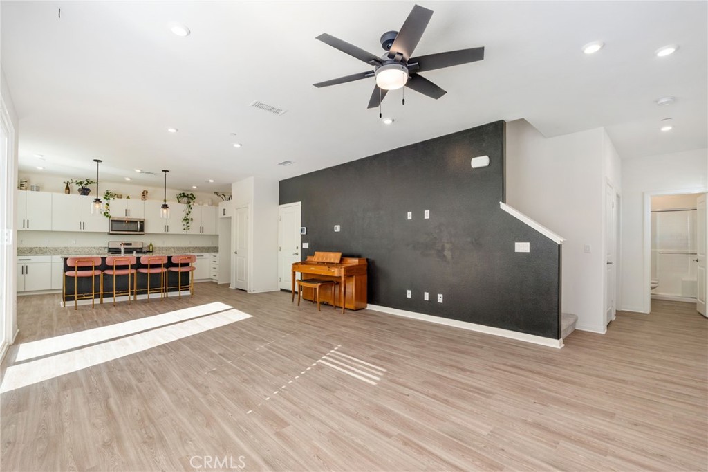 13430 Limestone Drive Yucaipa, CA 92399 - Photo 6 of 30 a living room with furniture and a wooden floor