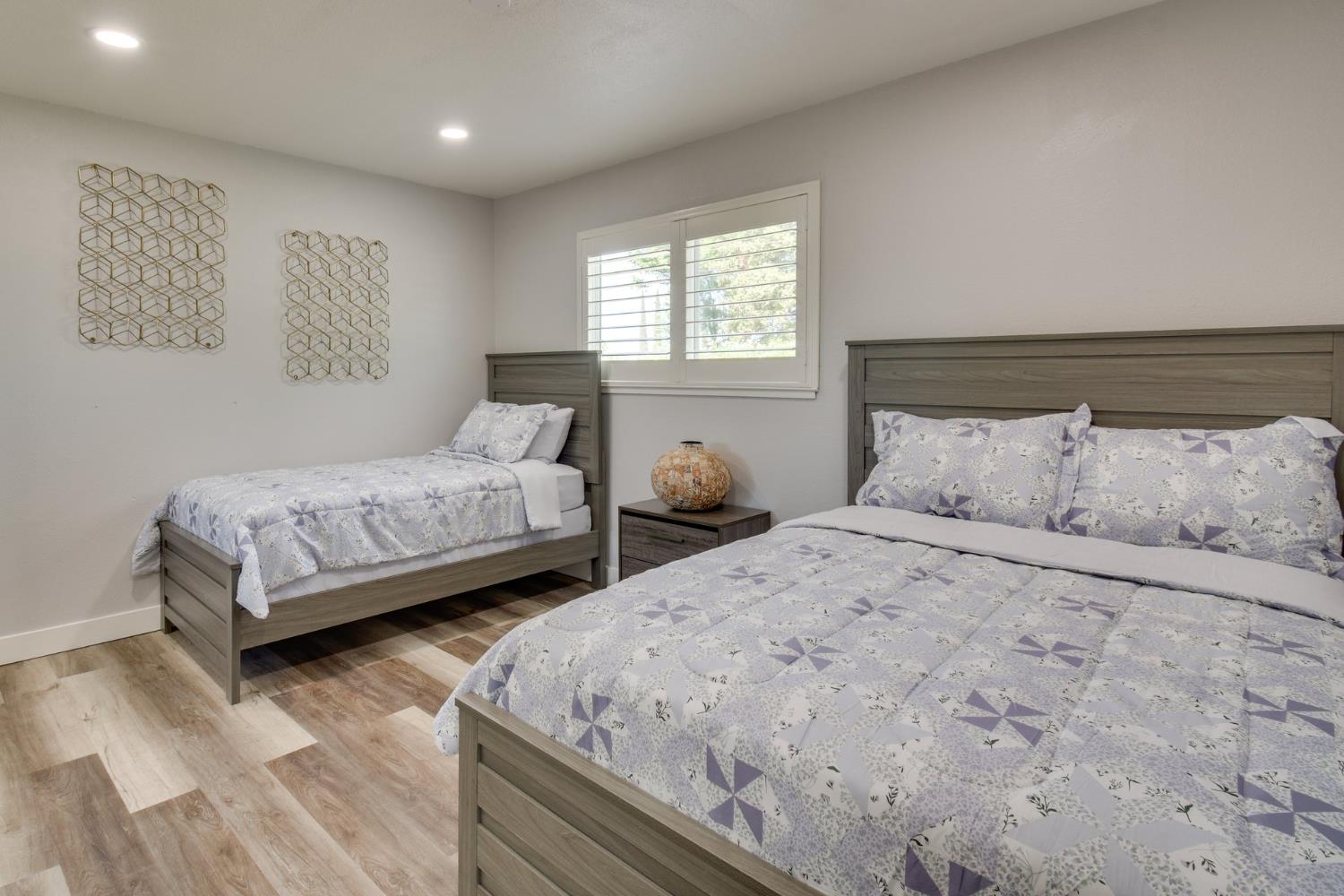 6034 Country Club Place Merced, CA 95340 - Photo 14 of 16 a bedroom with two beds and a couch