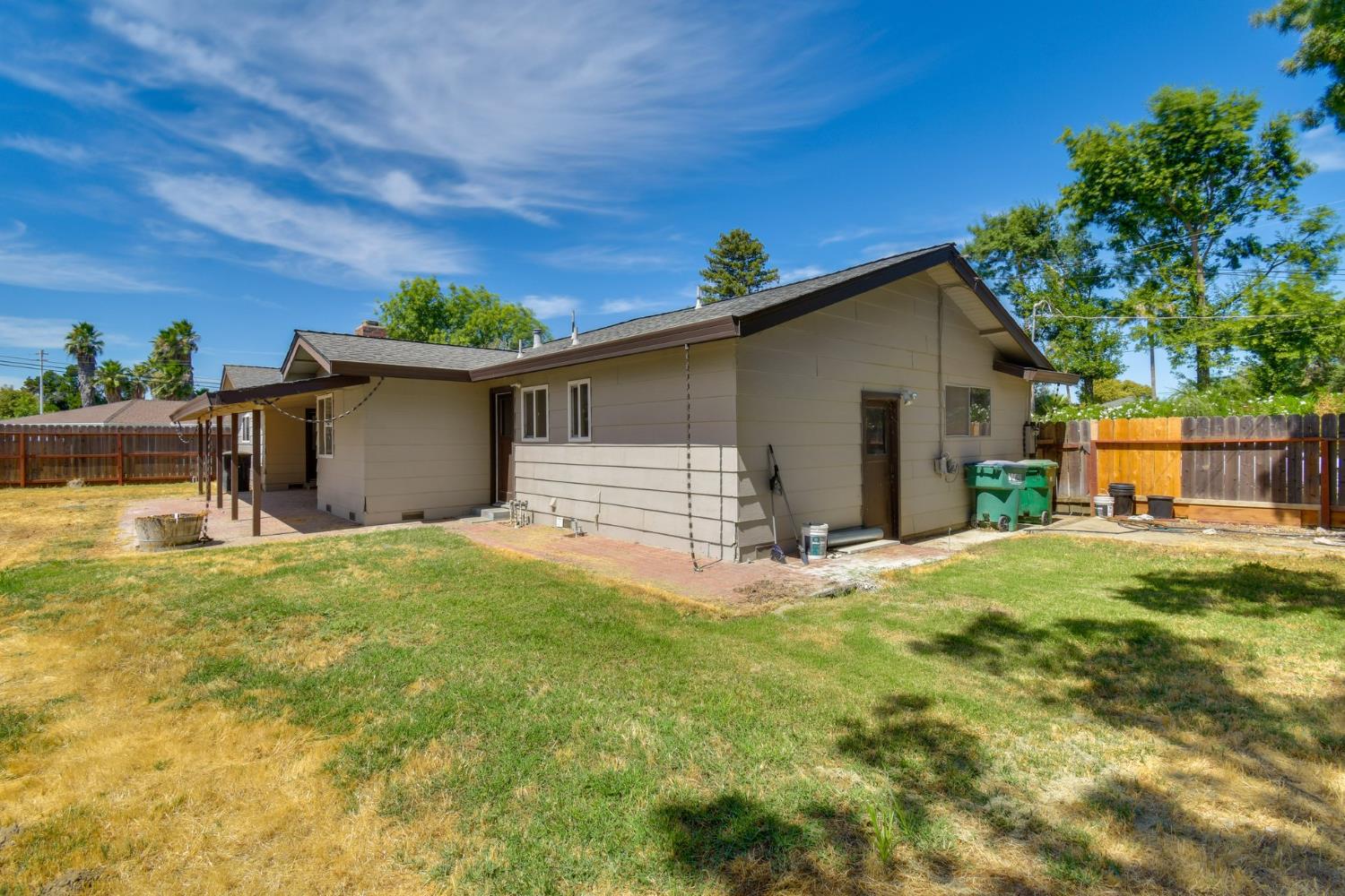 6034 Country Club Place Merced, CA 95340 - Photo 16 of 16 a backyard of a house with table and chairs