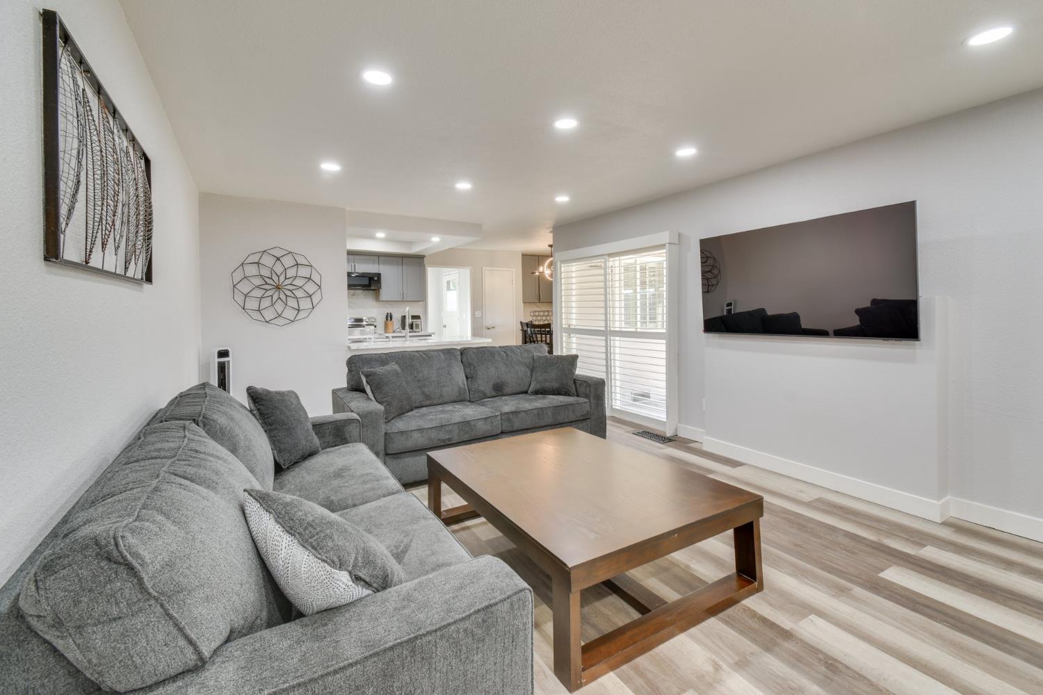 6034 Country Club Place Merced, CA 95340 - Photo 3 of 16 a living room with furniture and a flat screen tv