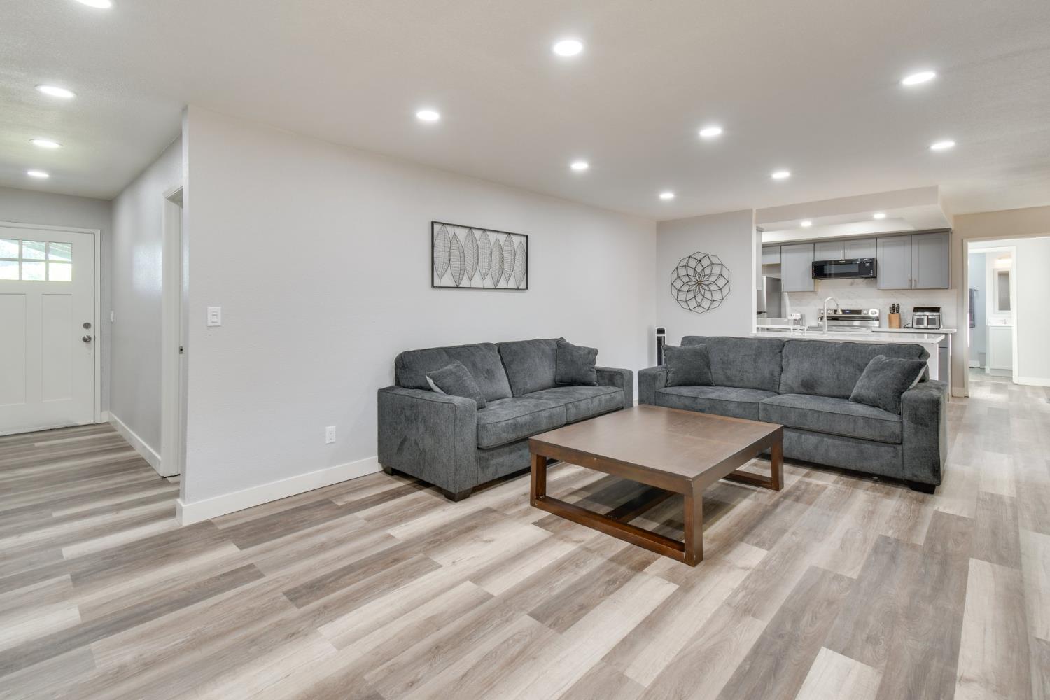 6034 Country Club Place Merced, CA 95340 - Photo 7 of 16 a living room with furniture and a wooden floor