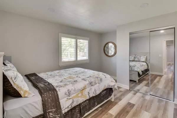 a bedroom with a bed and window