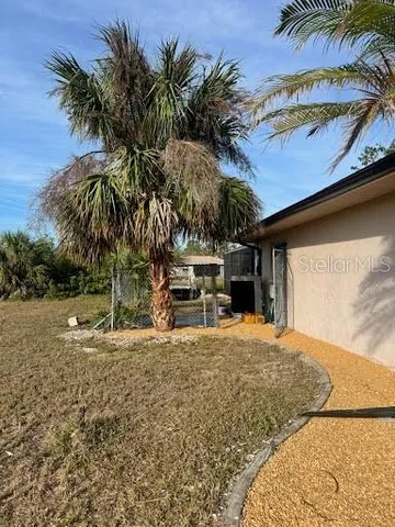 a view of a backyard with a sink and tub