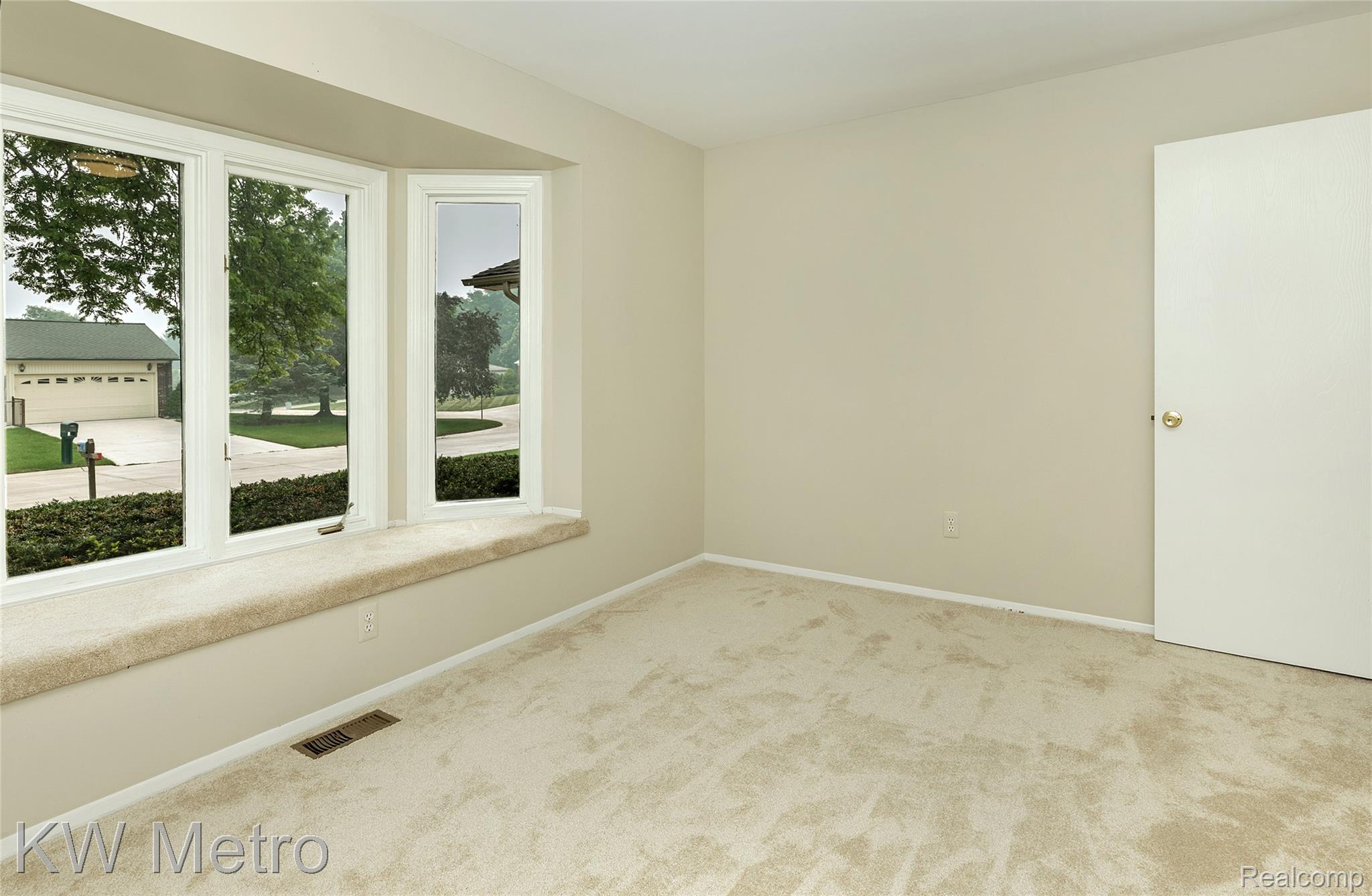 2154 Warrington Road Rochester, MI 48307 - Photo 22 of 41 Bay window with a carpeted window seat, light neutral wall paint, and beige carpet flooring