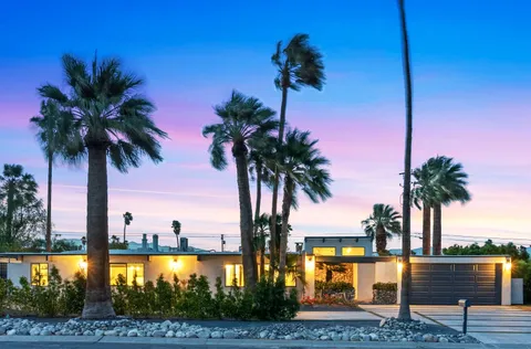 a view of swimming pool with seating space and furniture
