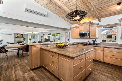 a bedroom with a large bed couch and a window