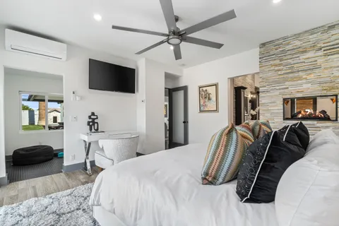 a spacious bathroom with a sink a mirror and shower