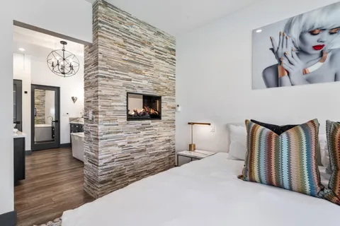 a bathroom with a tub sink and mirror