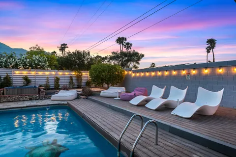 a view of a swimming pool with a patio