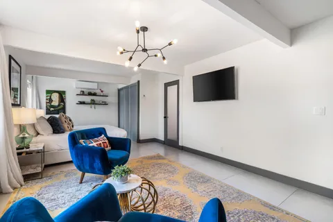 a dining room with a table and chairs