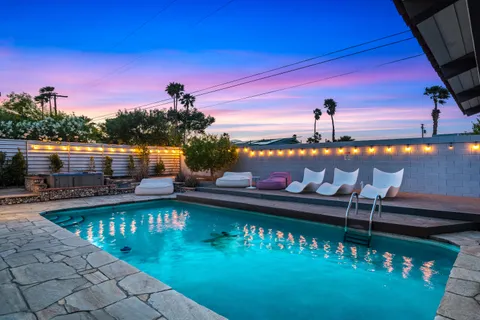 a view of a tables and chairs in patio