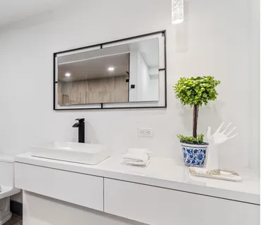 a view of a patio with table and chairs potted plants with wooden floor