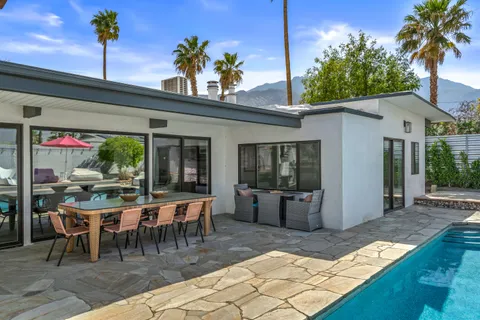 a view of a patio with furniture