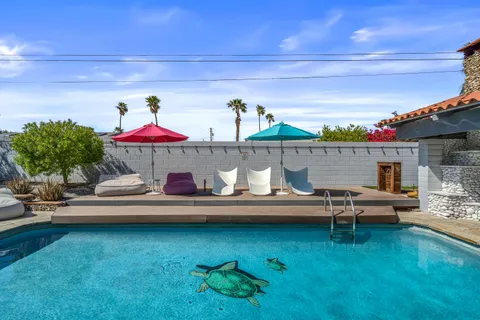 a front view of house with yard outdoor seating and barbeque oven