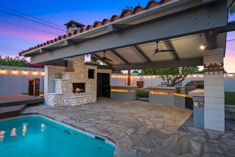 a view of a dining table and chairs in the patio