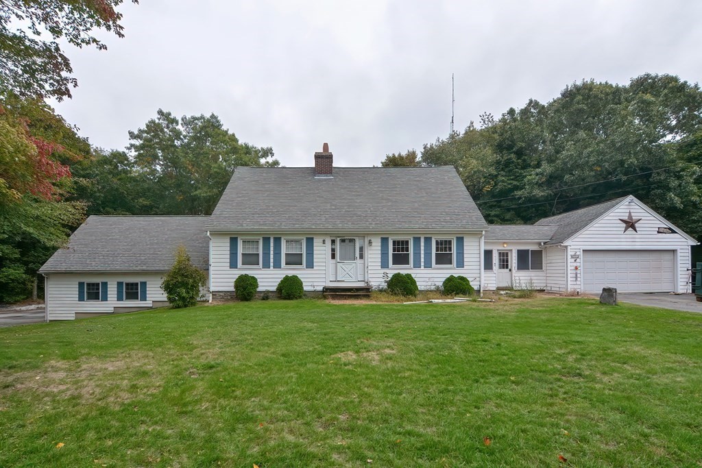 12 Ridgeview Road Sturbridge, MA 01566 - Photo 1 of 40 a view of a house with a big yard and large trees