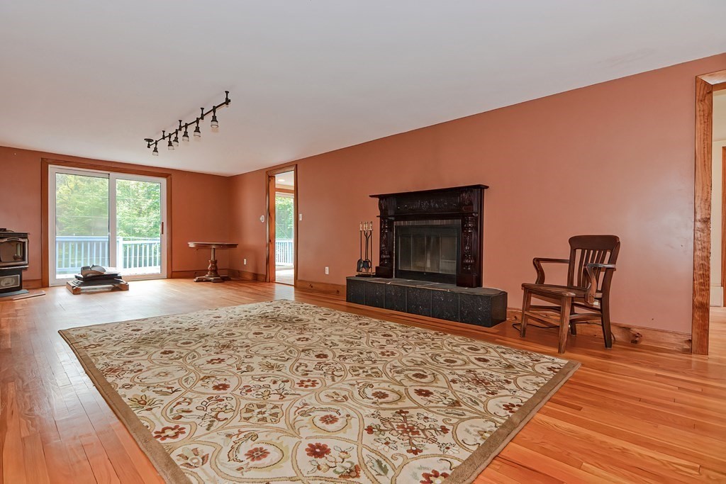 12 Ridgeview Road Sturbridge, MA 01566 - Photo 13 of 40 a living room with furniture and a fireplace