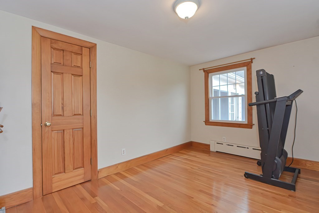 12 Ridgeview Road Sturbridge, MA 01566 - Photo 17 of 40 an empty room with windows wooden floor and window