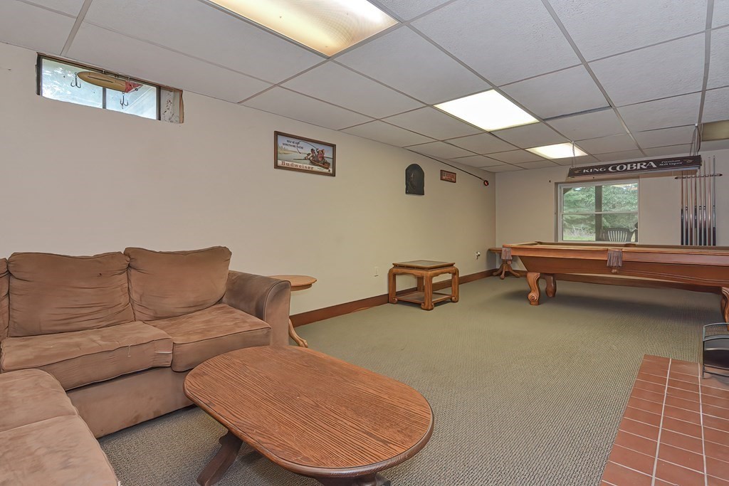 12 Ridgeview Road Sturbridge, MA 01566 - Photo 34 of 40 a living room with furniture and a large window