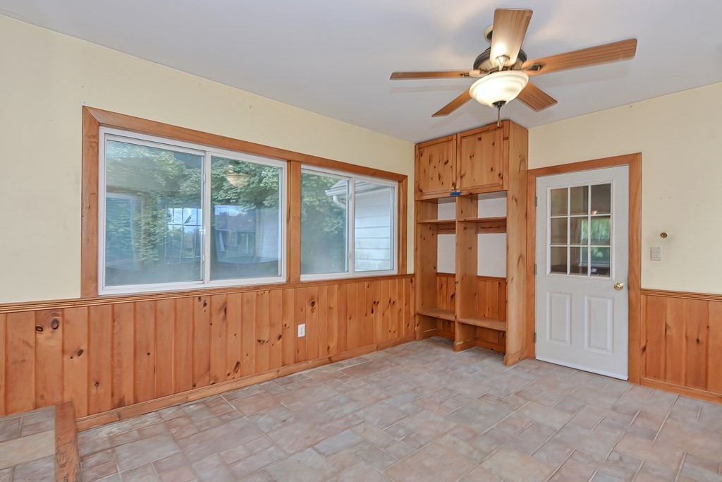 12 Ridgeview Road Sturbridge, MA 01566 - Photo 4 of 40 an empty room with chandelier fan and windows